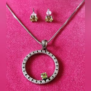 Silver 925 Necklace with Clear and a Green Rhinstone and earrings.